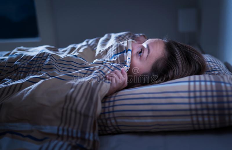 scared-woman-hiding-under-blanket-afraid-dark-unable-to-sleep-nightmare-bad-dream-awake-middle-night-144081611